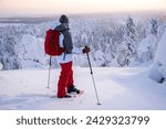 Woman snowshoeing in Lapland Finland