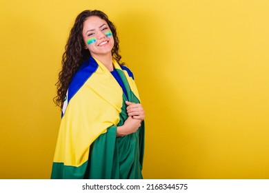 Woman Soccer Fan, Fan Of Brazil, Using Flag As Mantle Or Cape.