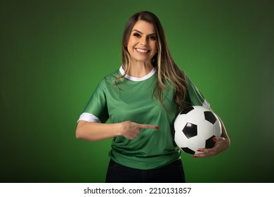 woman soccer fan cheering for her favorite club and team. world cup green background. - Shutterstock ID 2210131857
