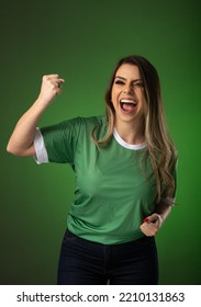 woman soccer fan cheering for her favorite club and team. world cup green background.