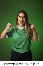 woman soccer fan cheering for her favorite club and team. world cup green background. - Shutterstock ID 2218146729
