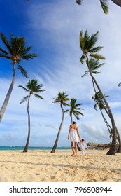 A Woman With A Son On A Bavaro Beach In Punta Cana Region Of Dominican Republic