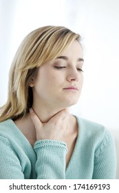 Woman With Sore Throat - Shutterstock ID 174169193
