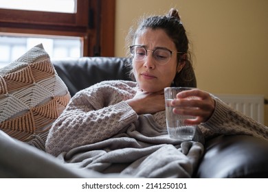 Woman With Sore Throat Drinking Water.