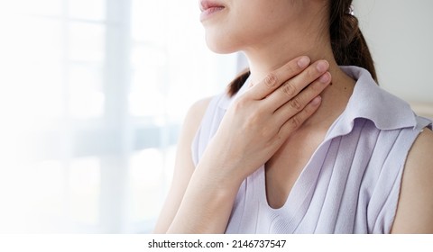 Woman With Sore Throat Inflamed Tonsils From Influenza Symptoms. Healthcare And Medical Concept