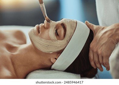 Woman, spa and face mask with brush or apply, pamper weekend and skincare wellness with client. Facialist, treatment and skin rejuvenation or pore tightening, relaxation and facial with people - Powered by Shutterstock