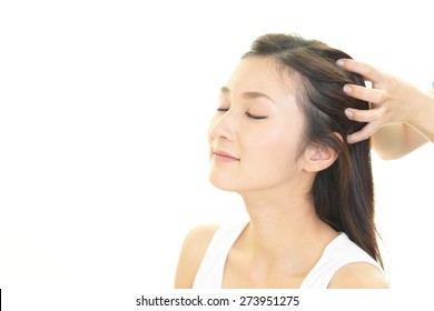 Woman In Spa Salon Receives Head Massage