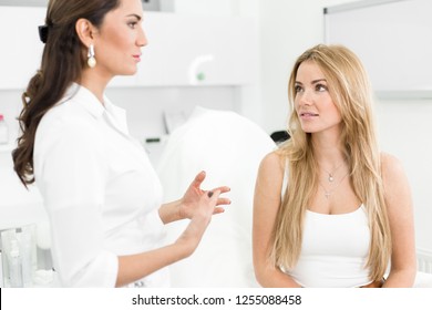 Woman Spa specialist consults a girl sitting in a chair