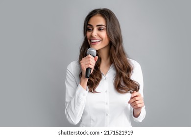 Woman Speech, Business Woman Holding A Microphone. Young Business Woman Talking With Mic. Woman Talking With Microphone. Communication And Information Concept.