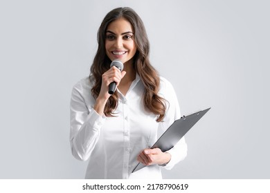 Woman Speech, Business Woman Holding A Microphone. Microphone Speech Speaking Concept. Young Beautiful Woman Singing Song Using Microphone.