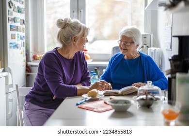 Woman spending time with her elderly mother at home

 - Powered by Shutterstock