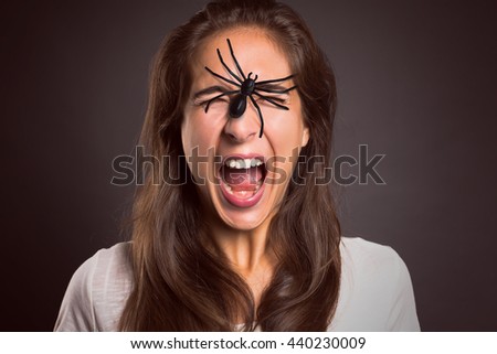 Woman with Spider on her Face