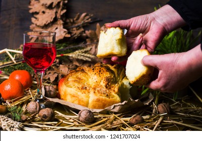 Woman Splitting Orthodox Christmas Eve Bread Closeup