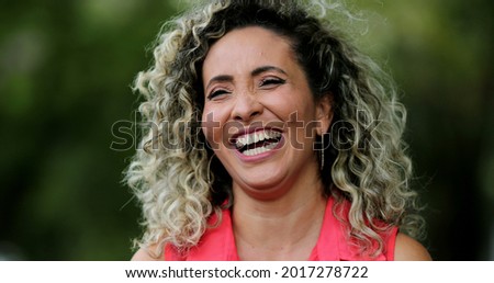 Woman spontaneous laugh, person burst laughing out loud, real life smile