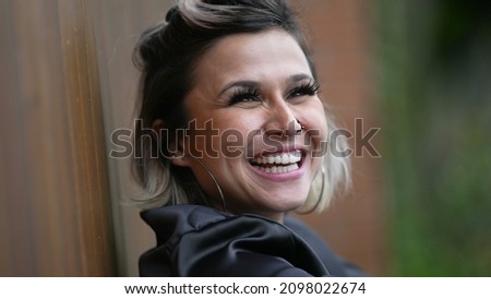 Woman spontaneous laugh. Person real life natural smile and happiness