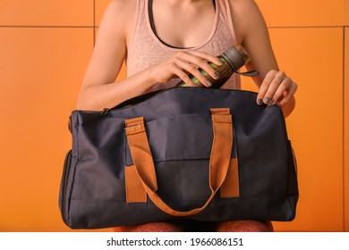 Woman With Sport Bag In Gym Locker Room