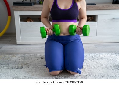 woman in sport outfit with extra weight, kg belly, not perfect body is exercising and loosing weight, concept of sport and fitness and healthy lifestyle