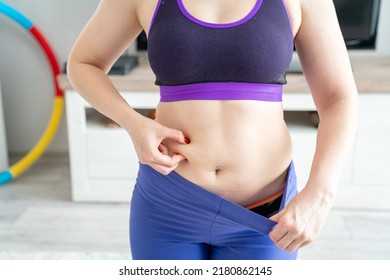 woman in sport outfit with extra weight, kg belly, not perfect body is exercising and loosing weight, concept of sport and fitness and healthy lifestyle. Body positive