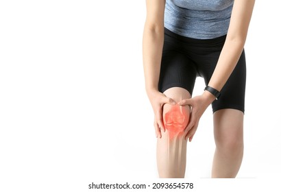 Woman in sportswear is holding painful knee joint (x-ray bone) - Shutterstock ID 2093654578