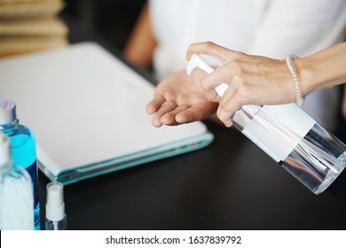 woman spraying alcohol gel or antibacterial soap sanitizer on Friend's hand.Hygiene ,Coronavirus concept.prevent the spread of germs and bacteria and avoid infections corona virus,covud19 virus - Powered by Shutterstock