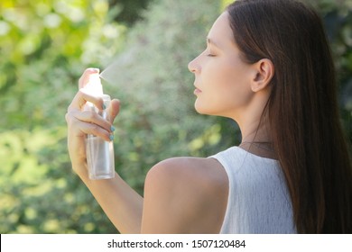 Woman spraying facial mist on her face, summertime skincare concept	 - Shutterstock ID 1507120484