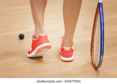 woman with squash racket 