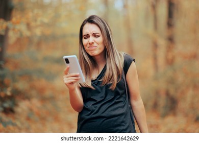 Woman Squinting Trying To See On The Mobile Phone Display. Person With Vision Problems Having Difficulties Reading On Her Smartphone
