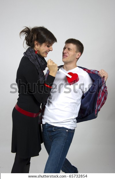 Woman Stabbing Young Mans Heart Knife Stock Photo (Edit Now) 65732854