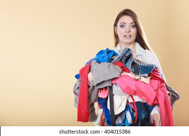 Woman With Stack Pile Of Dirty Laundry Clothes. Girl Cleaning Tidying.