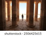 Woman Standing Amongst Columns in Egypt