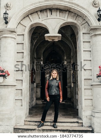 woman standing in the arch old historical temple fortress building church 