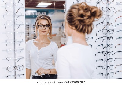 A woman is standing in front of a mirror in a store - Powered by Shutterstock