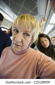 Woman Standing On City Bus