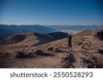 Woman standing on Dantes View in Death Valley National Park