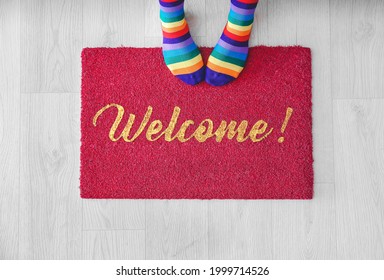 Woman Standing On Door Mat, Top View