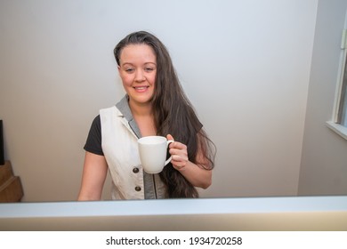 Woman Standing On Her Mat In Home Office Working At The Stand Up Ergonimc Desk