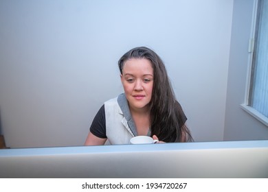 Woman Standing On Her Mat In Home Office Working At The Stand Up Ergonimc Desk