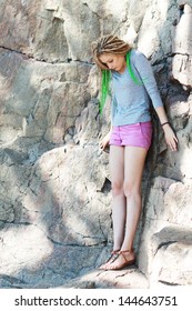 Woman Standing On Rocks With Acrophobia