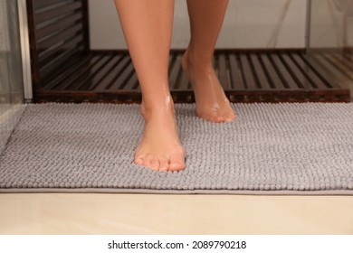 Woman Standing On Soft Mat Near Shower Stall In Bathroom, Closeup