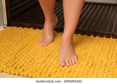 Woman Standing On Soft Mat Near Shower Stall In Bathroom, Closeup