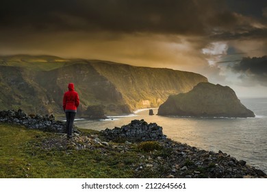 Woman Standing On A Top Of A Clif And Enjoying The View, Azores Island.