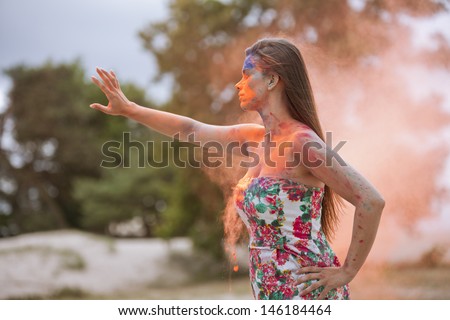 Woman standing in orange cloud