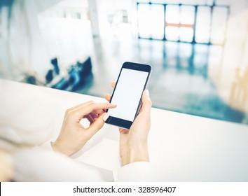 Woman Standing At Second Floor And Holding Her Smartphone In Hand, Touching A Screen On It. Visual Effects