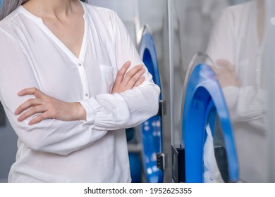 Woman Standing Waiting Near Major Household Appliance