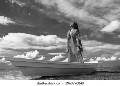 Woman Standing In White Boat By Still Lake With Closed Eyes. Dreaming Strong Emotions Pose. Resistance, Despair, Hope. Creative Artistic Series. Mixed Race. Beautiful Landscape. Psychology  Feelings