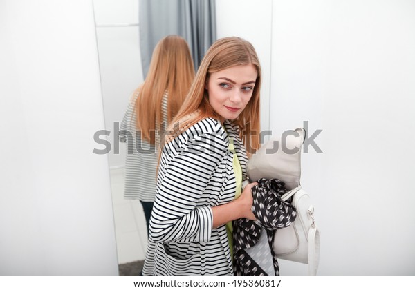 Woman stealing a\
dress