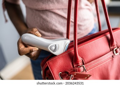 Woman Stealing Electric Feet Callus Remover In Retail Store. Shoplifting Theft Crime