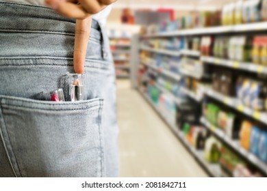 Woman Stealing Lipstick In Retail Store. Shoplifting Theft Crime