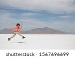 Woman steps over Bonneville Salt Flats International Speedway. Utah. USA. 