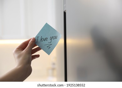 Woman With Sticky Note Saying I Love You Near Fridge Door, Closeup. Romantic Message